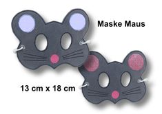 two masks with pink eyes and ears are shown in the shape of a cat's face