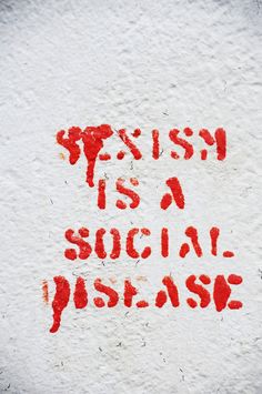 a red spray painted message on the side of a building that says, english is a social passage