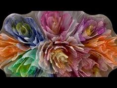 a group of flowers that are on top of a glass plate