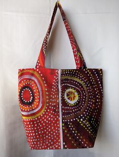 Introducing our Handmade Tote Bag crafted with Indigenous Fabric - a unique and culturally rich accessory thoughtfully created by our small business. This tote bag not only embodies functionality but also celebrates the artistry and heritage of Indigenous communities, offering a distinctive blend of practicality and cultural significance. 🌟 Key Features: Cultural Connection: Immerse yourself in the beauty and history of Indigenous artistry with our handmade tote bag, crafted using authentic Ind Artistic Brown Shoulder Bag For Daily Use, Artistic Brown Bag For Gifts, Artistic Red Shoulder Bag For Everyday, Artistic Red Shoulder Bag For Everyday Use, Artistic Handmade Tote Bag, Handmade Artistic Tote Bag, Artisan Rectangular Bag For Everyday, Artisan Square Bags For Daily Use, Brown Rectangular Bag For Festivals