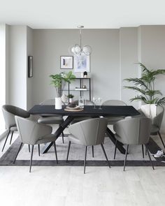 a dining room table with chairs around it