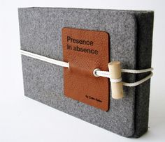 a book with a leather tag attached to it's cover and the words presence in ascendce