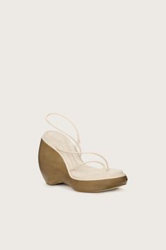 A sculptural, wood-effect wedge with thin straps in soft nappa leather.- Soft nappa leather with a cushioned rubber sole- Thin strapping at toes, bridge, and ankle- Wood-effect base Luna Sandals, Unique Heels, Embroidered Flats, Clear Shoes, Luxury Designer Shoes, Shoes On Sale, Swimming Bag, Cult Gaia, Unique Shoes