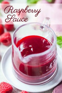 raspberry sauce in a glass jar on a plate