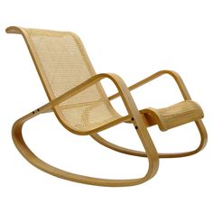 a wooden rocking chair with wicker seat and back support, viewed from the front