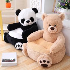 two stuffed animals sitting on top of a chair