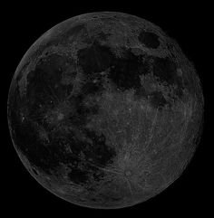 the full moon is shown in black and white