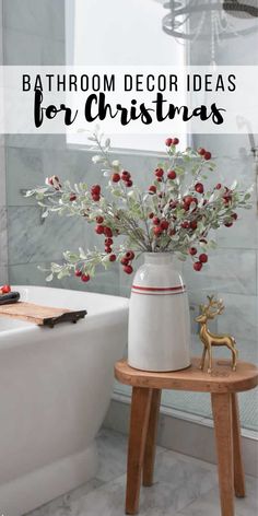 bathroom decor ideas for christmas with red berries and greenery in a white ceramic vase