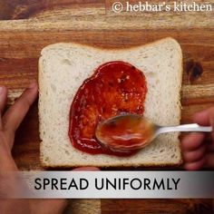 someone is spreading jam on a piece of bread with the words spread unforamily