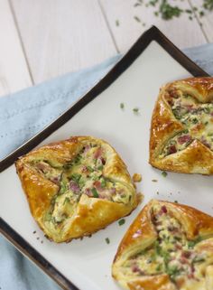 four small pastries on a white plate