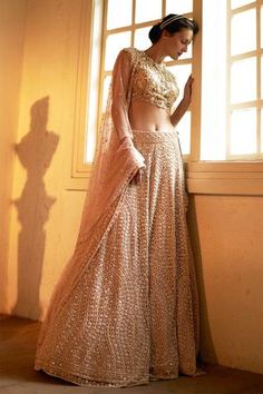 Beige lehenga highlighted with intricate thread-bead embroidery. Comes with round neckline blouse and dupatta.
Component: 3
Embroidered
Neckline: Round
Sleeve Length: Cap
Fabric: Silk, Tulle, Net
Color: Beige
Embroidered blouse and dupatta
Sheer back
Closure: 
Blouse: Concealed zip at the side
Lehenga: Drawstring at the side - Aza Fashions Round Neckline Blouse, Beautiful Lehenga, Beige Silk, Bridal Lehengas, Indian Bridal Dress, Embroidered Neckline, Wave Design, Silk Embroidery, Online Dress Shopping