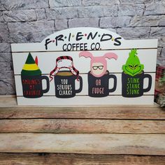 a wooden sign that says friends coffee co with some characters on it and the words, you