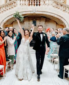 a newly married couple walking down the aisle