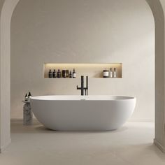 a large white bath tub sitting in a bathroom next to a shelf with bottles on it