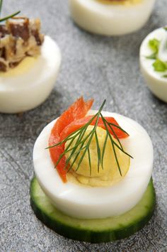 deviled eggs with smoked salmon and cucumber garnish