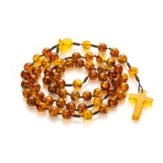 Amber Catholic rosary. These semi-precious Baltic amber rosary beads in the colors shown in the foto. In addition, we enriched it with delicate details - a hand-carved rose flower made of real Baltic Amber with a unique natural texture. Material: Baltic amber Length of the rosary with the cross: 44 cm. Circumference: 59cm. Cross length: 30 mm. Cross width: 19 mm. Bead size: 8mm. Weight: 19g. Baltic amber is renowned for its calming properties and the powerful energy it holds. Imagine feeling the Yellow Spiritual Rosary As Gift, Adjustable Amber Handmade Rosary, Adjustable Amber Spiritual Rosary, Amber Spiritual Healing Rosary, Amber Spiritual Rosary For Healing, Spiritual Amber Rosary For Healing, Adjustable Amber Rosary As Gift, Amber Rosary With 8mm Beads, Amber 8mm Beads Spiritual Rosary