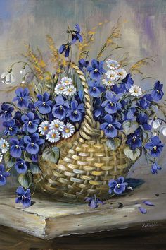 a basket filled with blue and white flowers