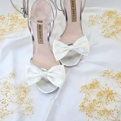 Elevate your footwear with our elegant White Bow Shoe Clips, crafted from luxurious pearl white satin made of recycled polyester. These versatile accessories are perfect for adding a touch of sophistication to any pair of shoes, whether you're wearing heels or sneakers. Material: Made from high-quality satin (recycled polyester), these bow clips offer a smooth, elegant finish that enhances the look of your shoes. Size: Each bow measures 2.15" (55mm) in height and 3.75" (95mm) in length, providin Wedding Shoes Bow, White Wedding Shoes, Bow Shoes, White Bow, Shoe Clips, Bow Clips, Bridal Shoes, Shoe Collection, Wedding Shoe