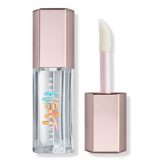 Gloss Bomb Heat Universal Lip Luminizer + Plumper - BenefitsXXL wand applies in just one swipeLight peach scentInstant plumping effectNon-sticky feelWith Plump Job Complex, an innovative blend of ingredients, including ginger root oil and capsicum fruit extract (pepper), to gently titillate and plump lipsWet-look shine, sheer colorKey IngredientsShea butter to condition lipsVitamin E to help lock in moistureFormulated WithoutPhthalatesParabens - Gloss Bomb Heat Universal Lip Luminizer + Plumper Lip Gloss Sephora, Fenty Beauty Gloss Bomb, Fenty Rihanna, Gloss Labial, Lip Paint, Dior Addict, Luminizer, Pat Mcgrath, Glass Slipper