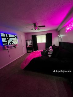 a bed room with a neatly made bed and purple lighting