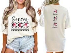 Celebrate your favorite soccer players with our custom soccer mom shirt, personalized with the players names and numbers on back. With short sleeves and a classic crewneck, this shirt makes the perfect gift for the soccer mama who loves to show her support on game day at the soccer fields, making her feel like a varsity soccer super fan. COMFORT COLORS 1717 SHIRT: Unisex 100% US cotton - ethically grown and harvested Pre-Shrunk Fabric Relaxed Fit - Size up for a trendy oversized look Seamless Si Personalized White Sporty T-shirt, Sporty Personalized T-shirt For Sports Events, Sporty Personalized T-shirt For Sports, Personalized Sporty T-shirt For Sports, Personalized Crew Neck T-shirt For Game Day, White Personalized Sporty Top, Sporty Personalized Short Sleeve Top, Sporty Personalized White Top, Personalized Crew Neck Tops For Fan Merchandise