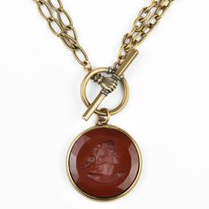 Marsala Glass Intaglio Collar - Goldmakers Fine Jewelry Elegant Medallion Jewelry With Toggle Clasp, Elegant Medallion Necklaces With Intaglio, Luxury Medallion Necklace With Intaglio, Elegant Medallion Toggle Necklace, Elegant Round Pendant Intaglio Necklace, Elegant Brass Toggle Clasp Necklace, Vintage Necklace With Toggle Clasp, Victorian Round Intaglio Necklaces, Victorian Round Intaglio Necklace