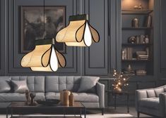 two lamps hanging from the ceiling in a living room