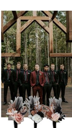 a group of men standing next to each other in front of a wooden structure with flowers