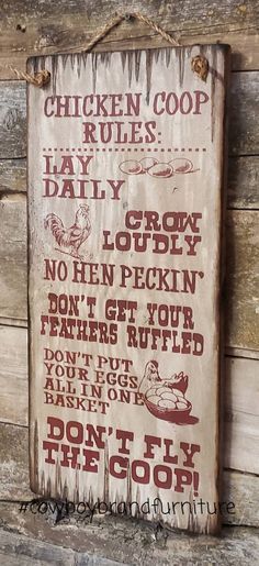 a sign on the side of a wooden building that says chicken coop rules daily daily