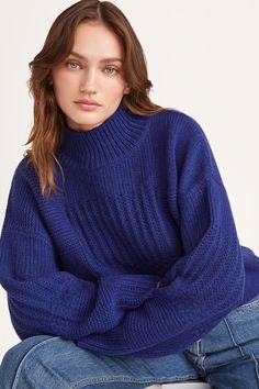 A timeless turtle neck sweater featuring our signature patchwork knit pattern, the VALAIS has a boxy fit and is crafted in a wool nylon blend. With chunky rib knit neck, cuffs and hem. Blue Funnel Neck Sweater With Ribbed Cuffs, Blue Winter Turtleneck With Ribbed Cuffs, Blue Ribbed Cuff Turtleneck For Winter, Blue Ribbed Cuffs Turtleneck For Winter, Blue Funnel Neck Sweater For Layering, Cozy Blue High Neck Sweater, Blue Turtleneck For Winter Layering, Blue Chunky Knit Turtleneck Sweater, Blue Turtleneck Sweater With Ribbed Cuffs