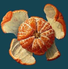 an orange cut in half on a blue background