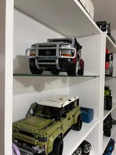 there are many toy cars on the shelves