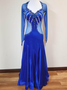 Queen of the Nile Fitted Royal Blue Satin Gown, Blue Fitted Gown With Sheer Bodice, Fitted Blue Gown With Sheer Bodice, Royal Long Sleeve Fitted Gown, Royal Long Sleeve Fitted Dresses, Fitted Satin Dress With Rhinestones, Fitted Royal Blue Embellished Gown, Fitted Blue Ballroom Dress, Blue Stretch Dresses For Ballroom