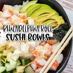 a bowl filled with shrimp, cucumber and avocado next to chopsticks