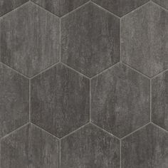 a gray tile wall with hexagonal tiles