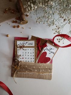 a table topped with lots of cards and flowers