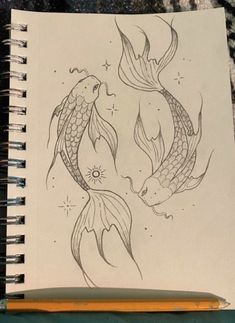 a drawing of two fish in the water