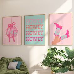 three posters are hanging on the wall above a green chair in a room with a potted plant