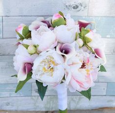 a bridal bouquet with pink and white flowers