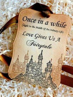 an ornament that says, once in a while with the middle of an ordinary life love gives us a fairy tale