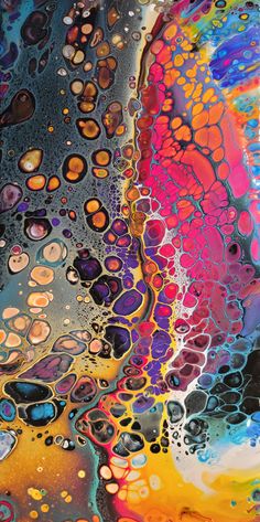 an abstract painting with lots of different colors and patterns on it's surface, as well as water droplets