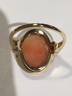 "This is a beautiful condition vintage 14kt yellow gold genuine hand carved shell cameo. Slightly worn but profile and features are very well defined in this classic face. Beautiful beaded bezel holds this cameo in place and the setting and fine detail on shank of ring are stunning. Cameo measures approximately 1/2\" wide and 5/8th \" long. Size 6. Shank is sturdy and this ring will last for generations to come. A true timeless classic. Inside is hallmarked(unreadable) and 14kt is stamped in it. Vintage 14k Gold Cameo Rings, Cameo 14k Gold Rings For Collectors, Collectible 14k Gold Cameo Rings, 14k Gold Cameo Rings For Collectors, Classic Cameo Rings, Classic Oval Cameo Rings, Gold Oval Cameo Signet Ring, Yellow Gold Cameo Signet Ring, Formal Cameo Signet Ring