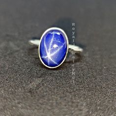 Star Sapphire Ring, Ring for Women, 925 Solid Sterling Silver Ring, Blue Sapphire Ring, Statement Ring, Gemstone Ring, Christmas Gift Gemstone details: Shape: Oval Stone: Star Sapphire Metal: Solid silver Stone Color: Blue Add this beautiful Ring in your accessories to make you feel unique. This ring have 925 stamp and you will receive a ring like the one in the picture. You can choose any size you want from drop down menu. We Accept Custom Order and Bulk Order Also, Feel free to contact me for Celestial Sapphire Rings As Gifts, Celestial Style Sapphire Rings As Gifts, Celestial Sterling Silver Star Ring, Celestial Style Sapphire Rings For Gifts, Celestial Blue Ring As A Gift, Celestial Blue Ring As Gift, Celestial Style Blue Ring As A Gift, Celestial Style Blue Ring As Gift, Blue Sterling Silver Star-shaped Ring