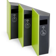 three black and green trash bins with arrows on the sides, one for recycling