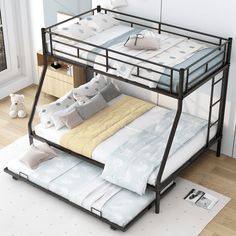 a bunk bed with two sets of mattresses on top of it in a room