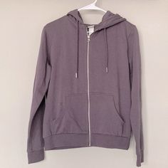 Like New. H&M Zip Up Hoodie In Purple. 2 Front Pockets. Approximate Length 23." Casual Cotton Hoodie By H&m, Casual Cotton Hoodie From H&m, Casual H&m Cotton Hoodie, H&m Hoodie With Drawstring Hood For Fall, H&m Hooded Sweatshirt For Fall, H&m Fall Sweatshirt With Drawstring Hood, H&m Hooded Tops For Fall, Zip Up Hoodie, Colorful Hoodies