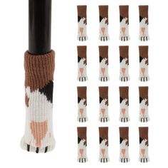 several pairs of socks with brown and white designs on them, next to a black pole