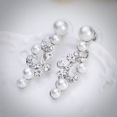 A classy bridal necklace and earrings set, perfect for the romantic bride! Adorned with iridescent pearls and clear crystals that capture the light from every angle sparkling beautifully, the pieces are rhodium plated for a flawless finish which enhances the intricate detailing and conveys a modern take on old elegance. Necklace: 16" long (approx. 41cm) with a 2.5" extension chain (approx. 6.5cm) which allows the length to be adjusted to 18.5" (approx. 47.5cm). If you would like it longer, pleas L Necklace, Crystal Bridal Jewelry Sets, Crystal Pearl Earrings, Bridal Pearl Necklace, Pearl Statement Necklace, Bridal Jewelry Set, Pearl Jewelry Wedding, Pearl Necklace Earrings, Pearl Jewelry Sets