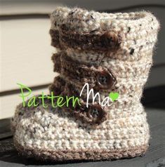 there is a pair of crocheted boots with buttons on the inside and outside