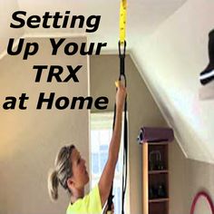 a woman in yellow shirt holding up a pair of scissors and measuring tape with the words setting up your trx at home